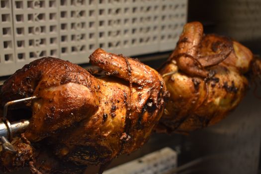 Fresh Cooked Rotisserie Chicken Still Rotating Inside the Rotisserie