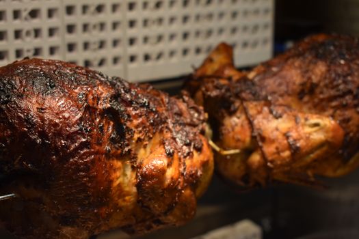 Fresh Cooked Rotisserie Chicken Still Rotating Inside the Rotisserie