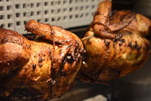 Fresh Cooked Rotisserie Chicken Still Rotating Inside the Rotisserie