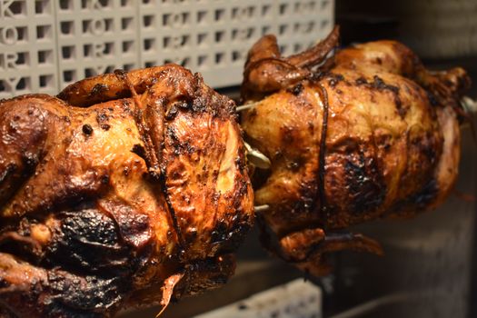 Fresh Cooked Rotisserie Chicken Still Rotating Inside the Rotisserie