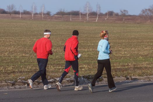 Three runners while training for a competition