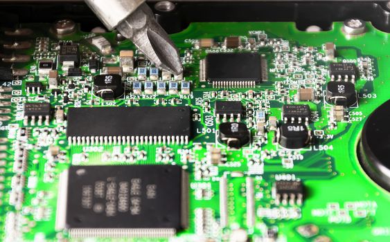repairing a printed circuit board. Micro technology and repairs. Electronic components and conductors