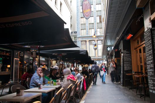 MELBOURNE, AUSTRALIA - JULY 26, 2018: People eat in Degraves lane in Melbourne Australia