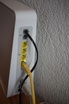 Router with cables and connectors flashes continuously when there is activity