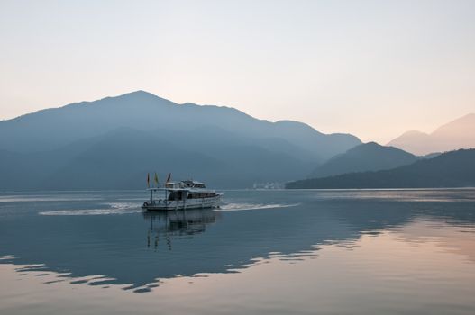 Boat sail calmly in Sun Moon Lake Taiwan