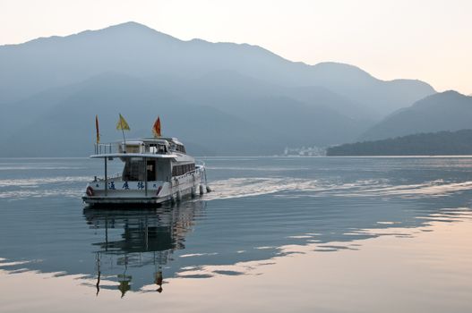 Tourist boat sailing in early morning Sun Moon Lake