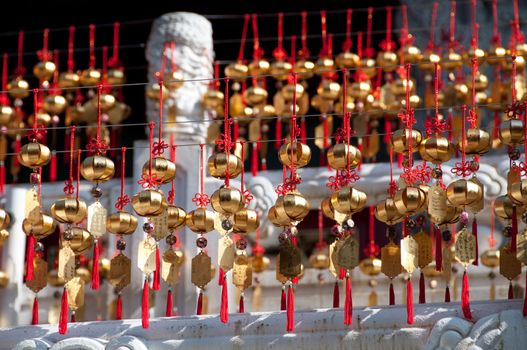 Golden wishing lucky bells in Taiwan temple