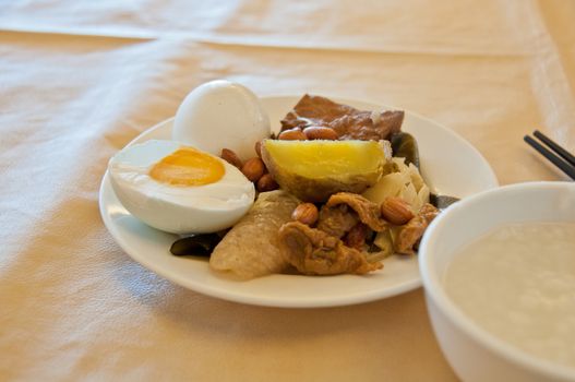 Chinese breakfast boiled rice with side dishes