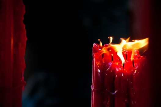 Bright red light candles melting