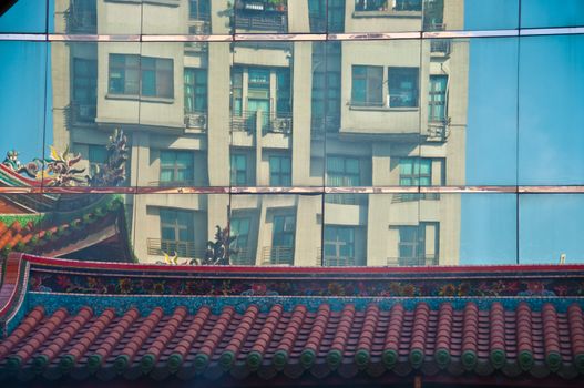 Temple roof and Apartment in busy Asian city