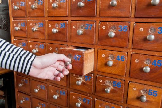 Hand opening wooden medicine box closet