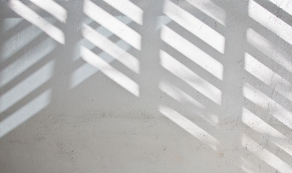 Sunlight shade on white wall