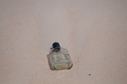 Empty bottle on a beach