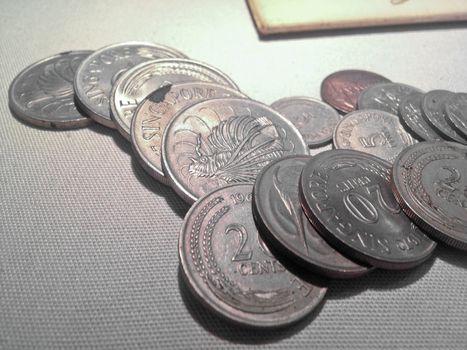 Singaporean silver coins laying together