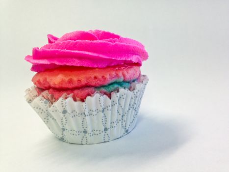 Pink yummy cup cake isolate side view