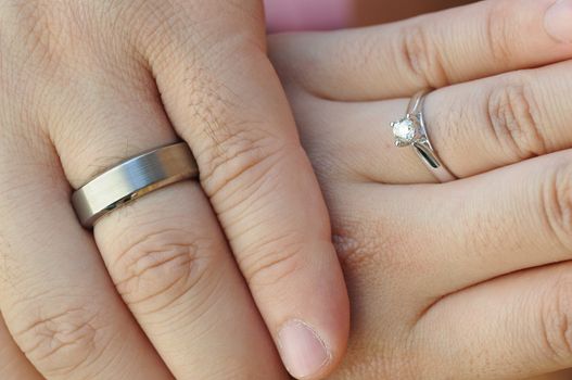 Wedding rings on fingers