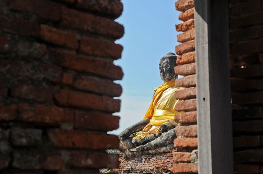 Window view to Ayudhaya Buddha statue Thailand