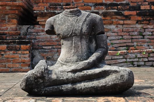 Sitting ancient Buddha statue in Thailand old temple