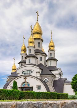 Buki, Ukraine 06.20.2020. Temple Complex with landscape Park in Buki, Ukraine, on a cloudy summer day