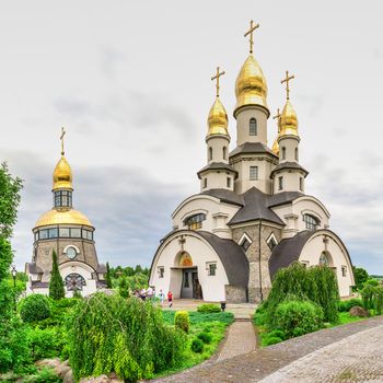 Buki, Ukraine 06.20.2020. Temple Complex with landscape Park in Buki, Ukraine, on a cloudy summer day