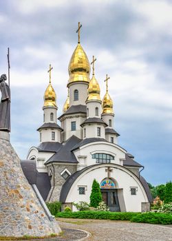 Buki, Ukraine 06.20.2020. Temple Complex with landscape Park in Buki, Ukraine, on a cloudy summer day