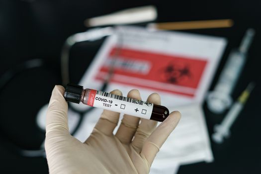 Coronavirus testing, a hand holds tube of blood test samples of coronavirus (COVID-19).