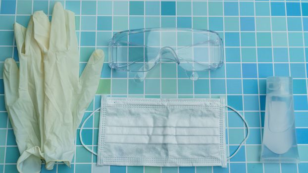 Must have items - surgical gloves, protective face mask, glasses and sanitizer gel corona virus or Covid-19 protection.