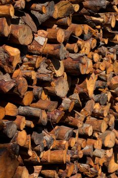 Firewood stacked and prepared for winter Pile of wood logs.