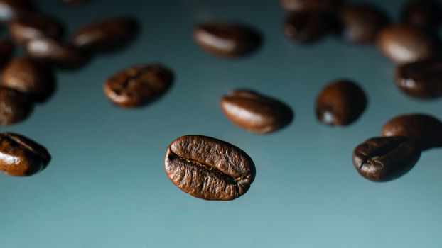 Roasted coffee beans pile on clear background.