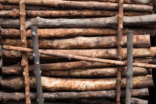 Firewood stacked and prepared for winter Pile of wood logs.