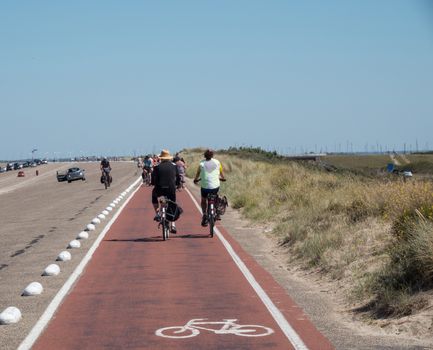 Ouddorp,Holland,05-aug-2020:people on bikes having vacation in holland and enjoy the touristspot like the brouwersdanm, this place is well know by tourists because of the watersport 