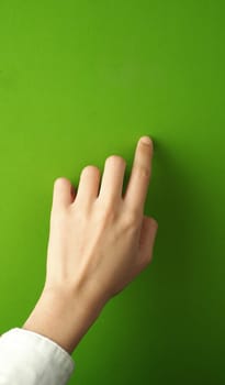 Woman finger and hand and touching on green screen background.
