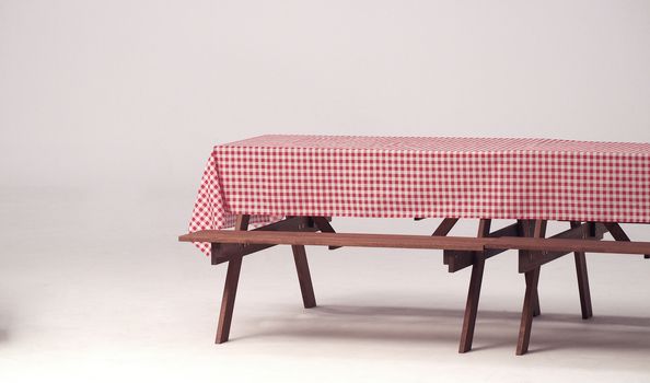 Wood table and red napkin for outdoor party and white background.