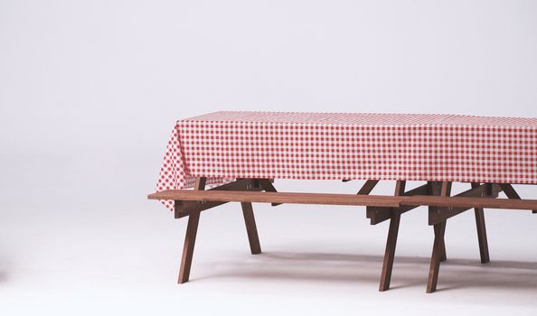 Wood table and red napkin for outdoor party and white background.