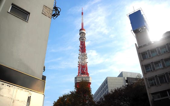 Tokyo tower red and white color steel metal and blue sky.