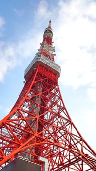 Tokyo tower red and white color steel metal and blue sky.