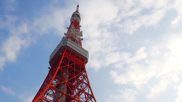Tokyo tower red and white color steel metal and blue sky.