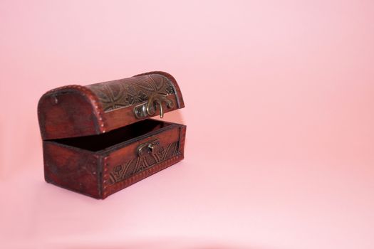 open gift box on a pink background close-up, copy space