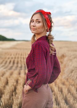 Woman farmer standing farmland smiling Female agronomist specialist farming agribusiness Happy positive caucasian worker agricultural field dressed red checkered shirt and bandana