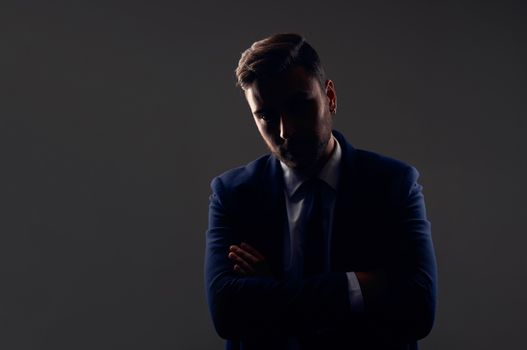 Close up portrait young unrecognizable man businessman Caucasian guy business suit studio gray background. Modern business person folded his arms over his chest Portrait successful young entrepreneur