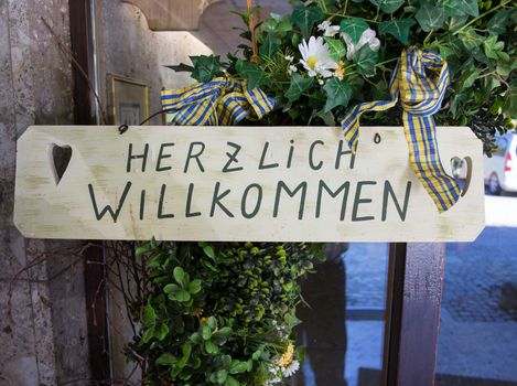German "Herzlich willkommen" sign translates into "Hearty Welcome" in English