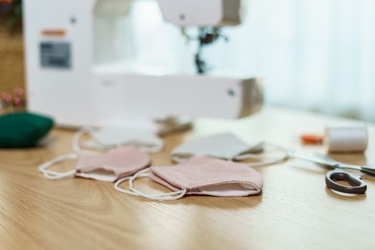 Fabrics, sewing accessories and sewing machine for sewing an anti-virus face mask during the coronavirus pandemia.