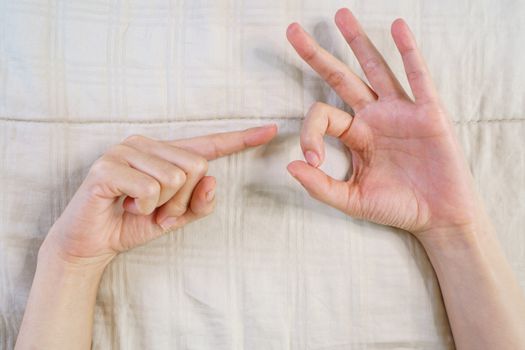 The sex hand sign. women's hands gesture indicating sex.