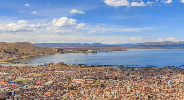 Panorama of peruvian city Puno and lake Titicaca, Peru