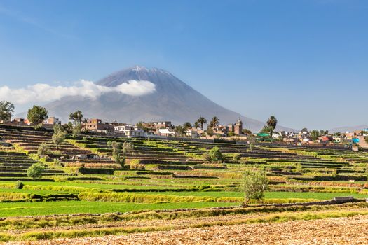 Dormant Misti Volcano over the fields and houses of peruvian city of Arequipa, Peru