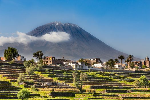 Dormant Misti Volcano over the fields and houses of peruvian city of Arequipa, Peru