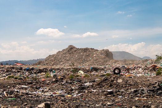 A huge landfill for waste disposal. Accumulation of garbage in landfill or deposit. Pollution concept.