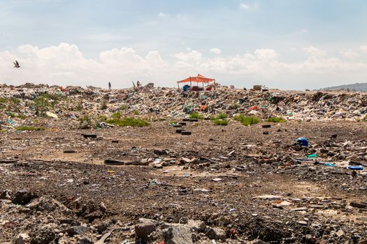 A huge landfill for waste disposal. Accumulation of garbage in landfill or deposit. Pollution concept.