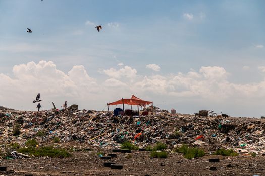 A huge landfill for waste disposal. Accumulation of garbage in landfill or deposit. Pollution concept.