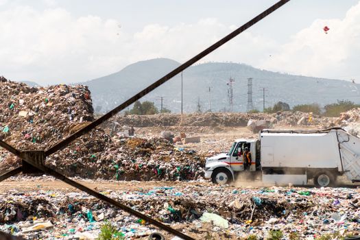 A huge landfill for waste disposal. Accumulation of garbage in landfill or deposit. Pollution concept.